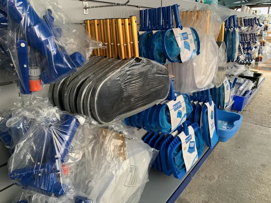 Pool nets, poles and brushes in store